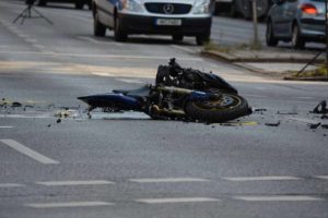 Crashed motorcycle due to collision.