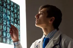 A doctor in assessing patient's findings in Seattle.