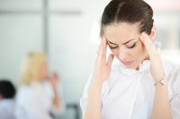A lady having severe headache months after her surgery.