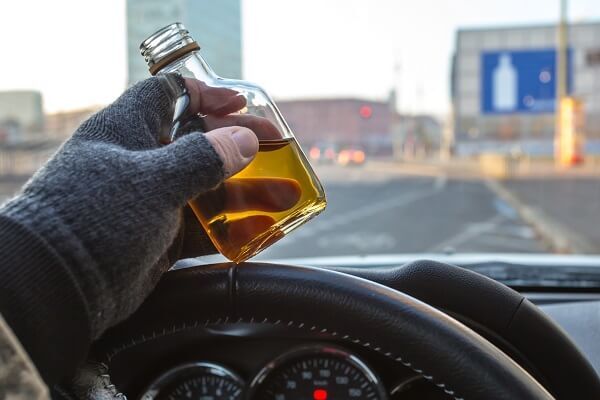 driver with flask of alcohol