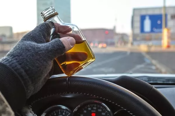 driver with flask of alcohol