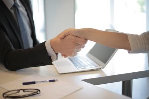 A handshake between a lawyer and a client in Tacoma, WA.